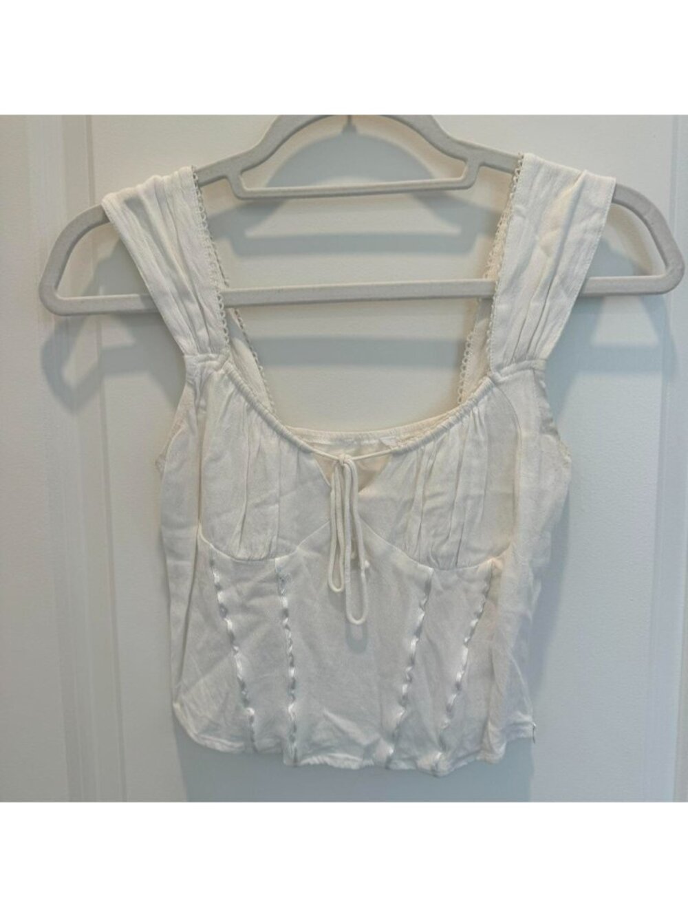 White corset top with tie in front and zipper on the side! #corsetry #summer